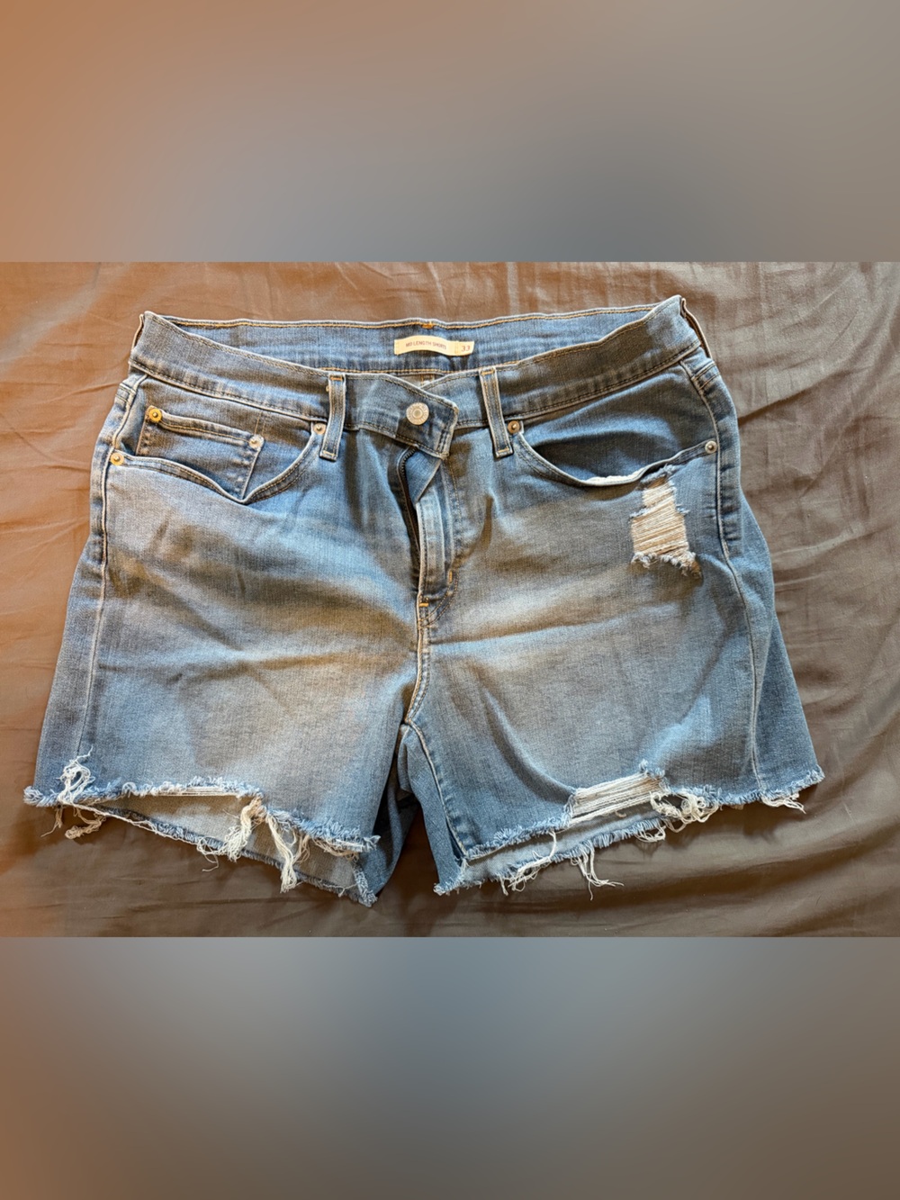 Like new distressed Levi cut-offs